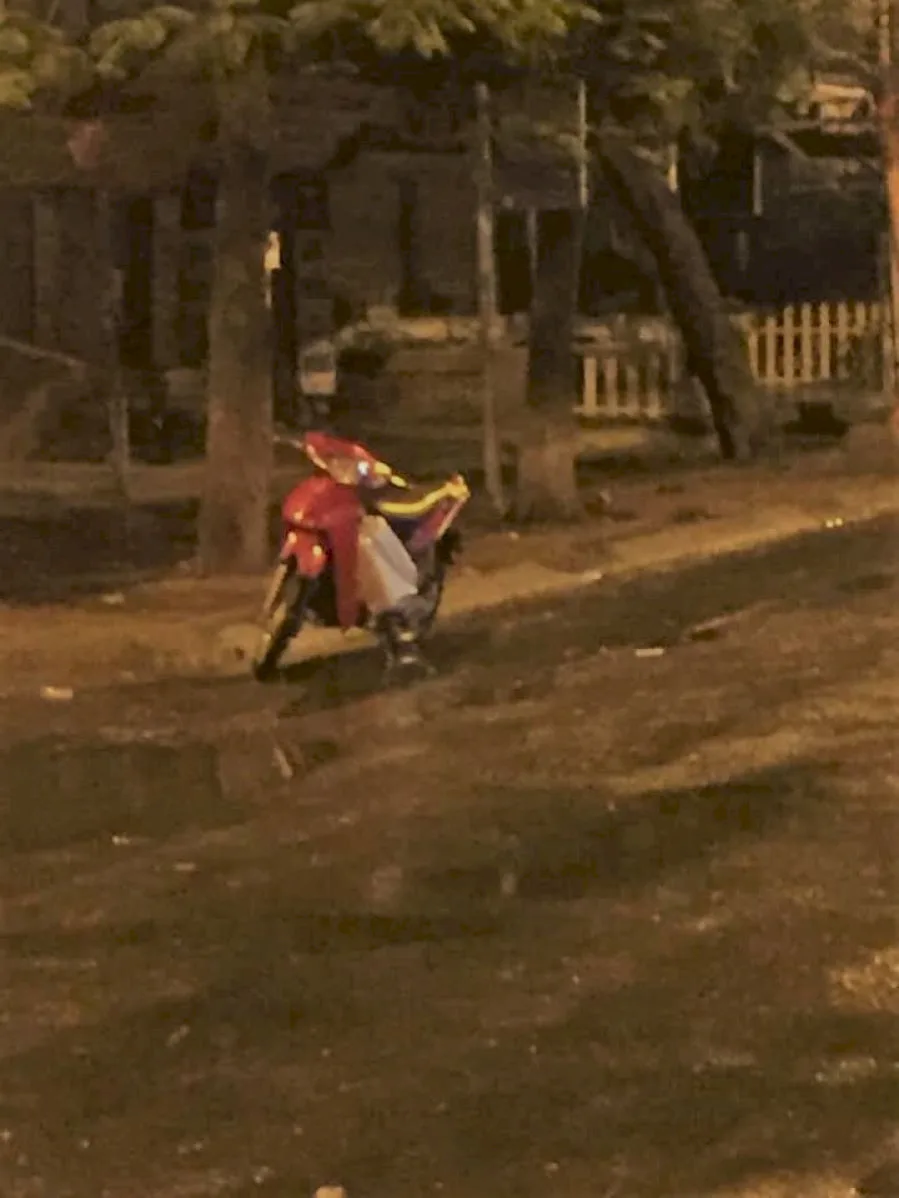 Heartbroken Young Man Sits Crying in the Middle of the Road Before Dawn